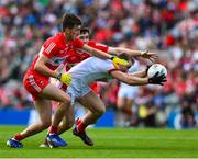 2 July 2023; Matty Taylor of Cork in action against Padraig McGrogan and Paul Cassidy of Derry during the GAA Football All-Ireland Senior Championship quarter-final match between Derry and Cork at Croke Park in Dublin. Photo by Ray McManus/Sportsfile