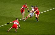 2 July 2023; Conor Corbett of Cork in action against Derry players, from left, Niall Loughlin, Brendan Rogers and Paul Cassidy during the GAA Football All-Ireland Senior Championship quarter-final match between Derry and Cork at Croke Park in Dublin. Photo by Brendan Moran/Sportsfile