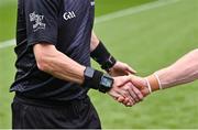 2 July 2023; Referee Joe McQuillan shakes hands with Cork captain Brian Hurley before the GAA Football All-Ireland Senior Championship quarter-final match between Derry and Cork at Croke Park in Dublin. Photo by Piaras Ó Mídheach/Sportsfile