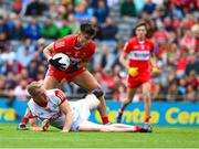 2 July 2023; Conor Doherty of Derry steps inside Ruairi Deane of Cork on his way to score a goal, in the 49th minute, during the GAA Football All-Ireland Senior Championship quarter-final match between Derry and Cork at Croke Park in Dublin. Photo by Ray McManus/Sportsfile