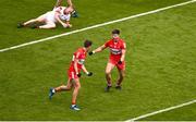 2 July 2023; Conor Doherty of Derry, right, celebrates with teammate Shane McGuigan after scoring their side's first goal during the GAA Football All-Ireland Senior Championship quarter-final match between Derry and Cork at Croke Park in Dublin. Photo by Brendan Moran/Sportsfile