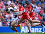 2 July 2023; Brian O'Driscoll of Cork in action against Conor Doherty and Paul Cassidy, right, of Derry during the GAA Football All-Ireland Senior Championship quarter-final match between Derry and Cork at Croke Park in Dublin. Photo by Piaras Ó Mídheach/Sportsfile