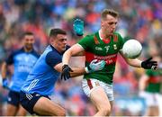 2 July 2023; Eoghan McLaughlin of Mayo in action against Brian Howard of Dublin during the GAA Football All-Ireland Senior Championship quarter-final match between Dublin and Mayo at Croke Park in Dublin. Photo by John Sheridan/Sportsfile