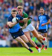 2 July 2023; Lee Gannon of Dublin is tackled by Jordan Flynn of Mayo during the GAA Football All-Ireland Senior Championship quarter-final match between Dublin and Mayo at Croke Park in Dublin. Photo by Ray McManus/Sportsfile
