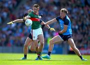 2 July 2023; Enda Hession of Mayo is tackled by Cormac Costello  and Seán Bugler of Dublin during the GAA Football All-Ireland Senior Championship quarter-final match between Dublin and Mayo at Croke Park in Dublin. Photo by Ray McManus/Sportsfile