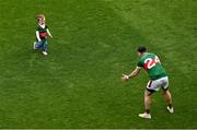 2 July 2023; Kevin McLoughlin of Mayo enjoys some time on the pitch with his daughter Saorla after the GAA Football All-Ireland Senior Championship quarter-final match between Dublin and Mayo at Croke Park in Dublin. Photo by Brendan Moran/Sportsfile