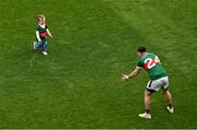 2 July 2023; Kevin McLoughlin of Mayo enjoys some time on the pitch with his daughter Saorla after the GAA Football All-Ireland Senior Championship quarter-final match between Dublin and Mayo at Croke Park in Dublin. Photo by Brendan Moran/Sportsfile