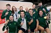 3 July 2023; Medalists, back row, from left, Dean Clancy, Kellie Harrington, Amy Wall, Nicola Bannon, Jodie Browne, and Nathan Tait; Front row, from left, Michaela Walsh, Jack Marley, Conor McGinchey and Aoife O'Rourke, pictured at Dublin Airport on Team Ireland's return from the European Games 2023 in Krakow, Poland. This evening Team Ireland athletes arrived back in Dublin Airport after a hugely successful European Games, bringing home a haul of 13 medals across boxing, kickboxing, athletics, rugby and taekwondo. The Krakow Games served as an Olympic qualifying event for several sports, with athletes in rugby and boxing securing a spot in next year’s Olympic Games. The number of Team Ireland athletes set to compete in Paris 2024 now sits at 37. Photo by Ramsey Cardy/Sportsfile