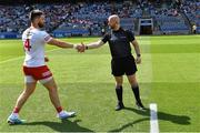 1 July 2023; Tyrone captain Pádraig Hampsey shakes hands with referee Brendan Cawley before the GAA Football All-Ireland Senior Championship quarter-final match between Kerry and Tyrone at Croke Park in Dublin. Photo by Piaras Ó Mídheach/Sportsfile