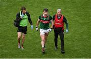 2 July 2023; Stephen Coen of Mayo is escorted from the pitch by team physiotherapist Garrett Coughlan, left, and Dr Sean Moffatt during the GAA Football All-Ireland Senior Championship quarter-final match between Dublin and Mayo at Croke Park in Dublin. Photo by Brendan Moran/Sportsfile