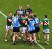 2 July 2023; Players from both teams tussle watched by referee David Gough during the GAA Football All-Ireland Senior Championship quarter-final match between Dublin and Mayo at Croke Park in Dublin. Photo by Brendan Moran/Sportsfile
