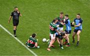 2 July 2023; Players from both teams tussle watched by referee David Gough during the GAA Football All-Ireland Senior Championship quarter-final match between Dublin and Mayo at Croke Park in Dublin. Photo by Brendan Moran/Sportsfile