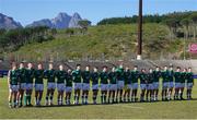 4 July 2023; The Ireland team wear black armbands and observe a minute's silence in memory of the late Munster Rugby elite performance officer Greig Oliver, father of U20 squad member Jack Oliver, and the recent tragedy on the Greek island of Ios involving two pupils from St Michael's College in Dublin, Max Wall and Andrew O'Donnell, before the U20 Rugby World Cup match between Fiji and Ireland at Danie Craven Stadium in Stellenbosch, South Africa. Photo by Nic Bothma/Sportsfile