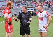 2 July 2023; Referee Joe McQuillan with team captains Conor Glass of Derry and Brian Hurley of Cork for the coin toss before the GAA Football All-Ireland Senior Championship quarter-final match between Derry and Cork at Croke Park in Dublin. Photo by Piaras Ó Mídheach/Sportsfile