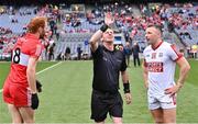 2 July 2023; Referee Joe McQuillan with team captains Conor Glass of Derry and Brian Hurley of Cork for the coin toss before the GAA Football All-Ireland Senior Championship quarter-final match between Derry and Cork at Croke Park in Dublin. Photo by Piaras Ó Mídheach/Sportsfile