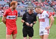 2 July 2023; Referee Joe McQuillan with team captains Conor Glass of Derry and Brian Hurley of Cork for the coin toss before the GAA Football All-Ireland Senior Championship quarter-final match between Derry and Cork at Croke Park in Dublin. Photo by Piaras Ó Mídheach/Sportsfile