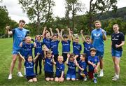 5 July 2023; Leinster players Rob Russell and Jordan Larmour with coach Sarah Browne and attendees during a Bank of Ireland Leinster Rugby Summer Camp at Stillorgan-Rathfarnham RFC in Dublin. Photo by Harry Murphy/Sportsfile
