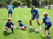 5 July 2023; Leinster player Jordan Larmour with attendees during a Bank of Ireland Leinster Rugby Summer Camp at Stillorgan-Rathfarnham RFC in Dublin. Photo by Harry Murphy/Sportsfile