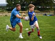 5 July 2023; Leinster player Jordan Larmour and Christopher Hatton during a Bank of Ireland Leinster Rugby Summer Camp at Stillorgan-Rathfarnham RFC in Dublin. Photo by Harry Murphy/Sportsfile
