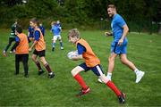 5 July 2023; Aaron Moran and Leinster player Jordan Larmour during a Bank of Ireland Leinster Rugby Summer Camp at Stillorgan-Rathfarnham RFC in Dublin. Photo by Harry Murphy/Sportsfile