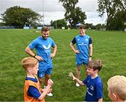 5 July 2023; Ben O'Toole and Aaron McCabe play rock paper scissors watched by Leinster players Jordan Larmour and Rob Russell during a Bank of Ireland Leinster Rugby Summer Camp at Stillorgan-Rathfarnham RFC in Dublin. Photo by Harry Murphy/Sportsfile