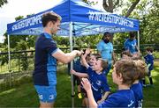 5 July 2023; Leinster player Rob Russell with attendees during a Bank of Ireland Leinster Rugby Summer Camp at Stillorgan-Rathfarnham RFC in Dublin. Photo by Harry Murphy/Sportsfile
