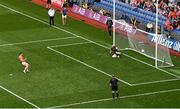 1 July 2023; Jason Duffy of Armagh scores his side's eighth penalty past Monaghan goalkeeper Rory Beggan in the penalty shoot out during the GAA Football All-Ireland Senior Championship quarter-final match between Armagh and Monaghan at Croke Park in Dublin Photo by Brendan Moran/Sportsfile