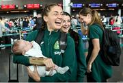 7 July 2023; Sinead Farrelly with Harry Byrne, age 5 weeks, from Dublin city, at Dublin Airport ahead of the Republic of Ireland's flight to Australia for the FIFA Women's World Cup 2023. Photo by Stephen McCarthy/Sportsfile