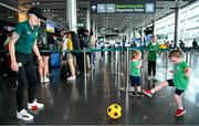 7 July 2023; Denise O'Sullivan with supporter Doireann Mulvaney, age 3 at Dublin Airport ahead of the Republic of Ireland's flight to Australia for the FIFA Women's World Cup 2023. Photo by Stephen McCarthy/Sportsfile