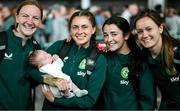 7 July 2023; Republic of Ireland players, from left, Courtney Brosnan, Sinead Farrelly, Marissa Sheva and Heather Payne, with Harry Byrne, age 5 weeks, from Dublin city, at Dublin Airport ahead of the Republic of Ireland's flight to Australia for the FIFA Women's World Cup 2023. Photo by Stephen McCarthy/Sportsfile