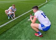 1 July 2023; Gary Mohan of Monaghan takes a photograph of his teammate Kieran Hughes of Monaghan with his daughter Cara, age 9 months, after the GAA Football All-Ireland Senior Championship quarter-final match between Armagh and Monaghan at Croke Park in Dublin. Photo by Piaras Ó Mídheach/Sportsfile