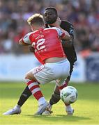 7 July 2023; Babatunde Owolabi of Cork City and Sam Curtis of St Patrick's Athletic tussle as they race for the ball during the SSE Airtricity Men's Premier Division match between St Patrick's Athletic and Cork City at Richmond Park in Dublin. Photo by Piaras Ó Mídheach/Sportsfile