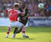 7 July 2023; Babatunde Owolabi of Cork City and Sam Curtis of St Patrick's Athletic tussle as they race for the ball during the SSE Airtricity Men's Premier Division match between St Patrick's Athletic and Cork City at Richmond Park in Dublin. Photo by Piaras Ó Mídheach/Sportsfile