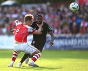7 July 2023; Babatunde Owolabi of Cork City and Sam Curtis of St Patrick's Athletic tussle as they race for the ball during the SSE Airtricity Men's Premier Division match between St Patrick's Athletic and Cork City at Richmond Park in Dublin. Photo by Piaras Ó Mídheach/Sportsfile