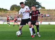 7 July 2023; Paddy Kirk of Bohemians is tackled by Archie Davies of Dundalk during the SSE Airtricity Men's Premier Division match between Bohemians and Dundalk at Dalymount Park in Dublin. Photo by Tyler Miller/Sportsfile