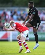 7 July 2023; Jay McGrath of St Patrick's Athletic in action against Babatunde Owolabi of Cork City during the SSE Airtricity Men's Premier Division match between St Patrick's Athletic and Cork City at Richmond Park in Dublin. Photo by Piaras Ó Mídheach/Sportsfile