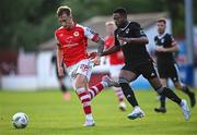 7 July 2023; Sam Curtis of St Patrick's Athletic in action against Babatunde Owolabi of Cork City during the SSE Airtricity Men's Premier Division match between St Patrick's Athletic and Cork City at Richmond Park in Dublin. Photo by Piaras Ó Mídheach/Sportsfile