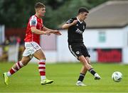 7 July 2023; Barry Coffey of Cork City in action against Thomas Lonergan of St Patrick's Athletic during the SSE Airtricity Men's Premier Division match between St Patrick's Athletic and Cork City at Richmond Park in Dublin. Photo by Piaras Ó Mídheach/Sportsfile