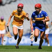 8 July 2023; Caitrin Dobbin of Antrim in action against Karen Kennedy of Tipperary during the All-Ireland Senior Camogie Championship quarter-final match between Tipperary and Antrim at Croke Park in Dublin. Photo by Stephen Marken/Sportsfile