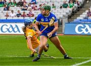 8 July 2023; Cait Devane of Tipperary in action against Katie Laverty of Antrim during the All-Ireland Senior Camogie Championship quarter-final match between Tipperary and Antrim at Croke Park in Dublin. Photo by Stephen Marken/Sportsfile
