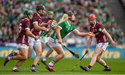 8 July 2023; Peter Casey of Limerick in action against Galway players, from left, Evan Niland, Pádraic Mannion and Tom Monaghan during the GAA Hurling All-Ireland Senior Championship semi-final match between Limerick and Galway at Croke Park in Dublin. Photo by Brendan Moran/Sportsfile