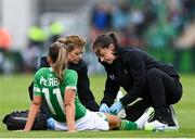 6 July 2023; Katie McCabe of Republic of Ireland receives medical attention from physiotherapist Angela Kenneally, right, and team doctor Siobhan Forman during the women's international friendly match between Republic of Ireland and France at Tallaght Stadium in Dublin. Photo by Stephen McCarthy/Sportsfile