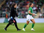 6 July 2023; Katie McCabe of Republic of Ireland accompanied by Republic of Ireland physiotherapist Angela Kenneally during the women's international friendly match between Republic of Ireland and France at Tallaght Stadium in Dublin. Photo by Stephen McCarthy/Sportsfile