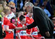 9 July 2023; Uachtarán Chumann Lúthchleas Gael Larry McCarthy meets Derry flagbearers before the Electric Ireland GAA Football All-Ireland Minor Championship final match between Derry and Monaghan at Box-IT Athletic Grounds in Armagh. Photo by Ramsey Cardy/Sportsfile