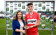 9 July 2023; Electric Ireland Sales & Marketing Manager Una Lavery presents Conall Higgins of Derry with the Electric Ireland Best & Fairest award following his major performance in the Electric Ireland GAA Football All-Ireland Minor Championship final match between Derry and Monaghan at Box-It Athletic Grounds in Armagh. Photo by Ramsey Cardy/Sportsfile