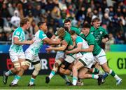 9 July 2023; Hugh Gavin of Ireland, centre, attempts to break the tackle of South Africa defence during the U20 Rugby World Cup semi-final match between Ireland and South Africa at Athlone Sports Stadium in Cape Town, South Africa. Photo by Shaun Roy/Sportsfile