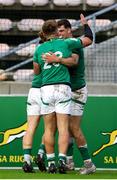 9 July 2023; Ireland players, Henry McErlean, Sam Berman, 23, and James Nicholson of Ireland celebrate after scoring his sides's second try during the U20 Rugby World Cup semi-final match between Ireland and South Africa at Athlone Sports Stadium in Cape Town, South Africa. Photo by Shaun Roy/Sportsfile
