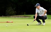 9 July 2023; Peter Cosgrove of Castle Golf Club lines up a putt on the Eleventh green during the 61st All Ireland Father & Sons Championship at Castle Golf Club in Rathfarnham, Dublin.  Photo by Tyler Miller/Sportsfile