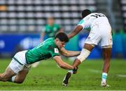 9 July 2023; James Nicholson of Ireland tackles Hakeem Kunene of South Africa during the U20 Rugby World Cup semi-final match between Ireland and South Africa at Athlone Sports Stadium in Cape Town, South Africa. Photo by Shaun Roy/Sportsfile