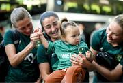 10 July 2023; Republic of Ireland players, from left, Sinead Farrelly, Marissa Sheva and Sophie Whitehouse with 15-month-old Elsie Lyons, from Brisbane, whose father David hails from Tralee, Kerry, at Brisbane, Australia, ahead of the start of the FIFA Women's World Cup 2023. Photo by Stephen McCarthy/Sportsfile